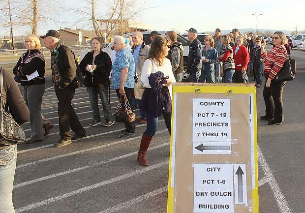 Hundreds of Republican caucus goers wait in line Tuesday at the multi-purpose building.