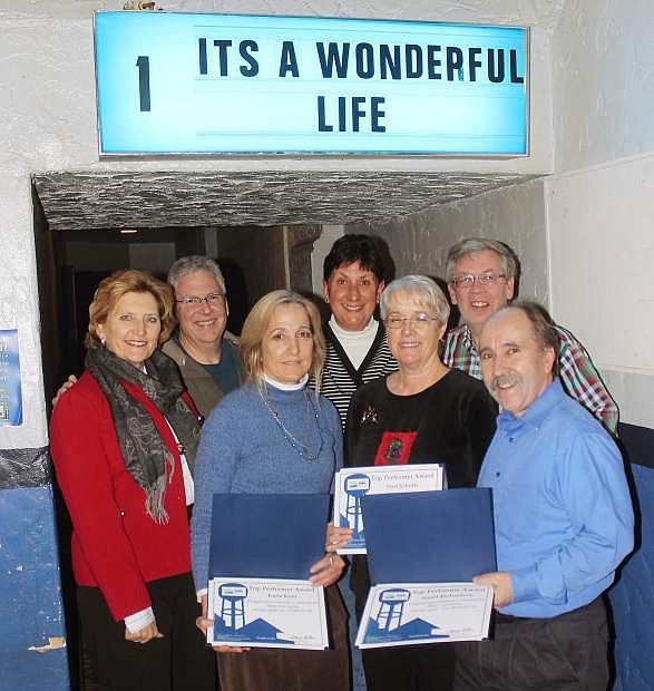 Sarah Adler, left, of USDA, recognized the Fallon Community Theatre Inc., and others who have spent hours trying to restore the historic Fallon landmark. She gave certificates to those for theri commitment to Maine Street vitality and working together, concluding with &quot;It&#039; a Wonderful Life.&quot; From left are Adler, Mike Berney, Karla Kent, Yvonne Sutherland, Terri Schultz, Glen Perazzo and Dr. Stuart Richarson.