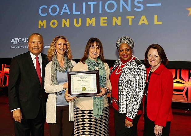 The Churchill Community Coaliton recently received national recognition. From left are retired Army Maj. Gen. Arthur Dean, CADCA chairman and CEO; Mary Beth Chamberlain, projects coordinator, Churchill Community Coalition; Andrea Zeller, executive director, Churchill Community Coalition; Kareemah Abdullah, director National Coalition Institute; and an unidentified woman.