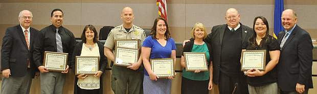The Churchill County Commissioners awarded, from the left, Jorge Guerrero, Michelle E. Gulden, Sheriff Ben Trotter, Amy Lawry, Sue Sevon and Brenda C. Mahan among other employees in the county for their years of service.