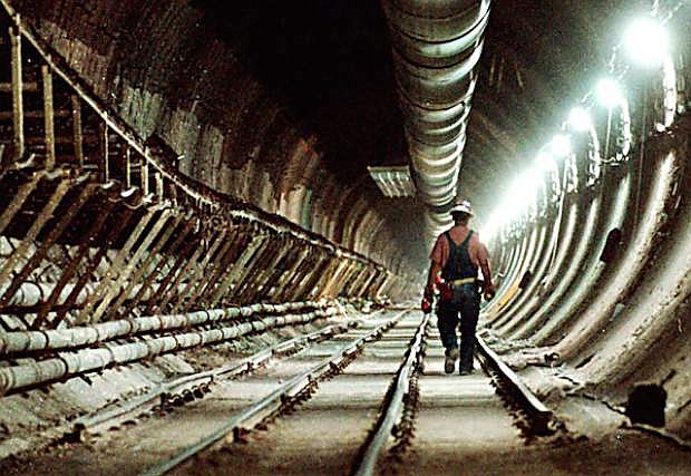 A construction worker passes through the main tunnel inside Yucca Mountain, Nev., in this file photo.