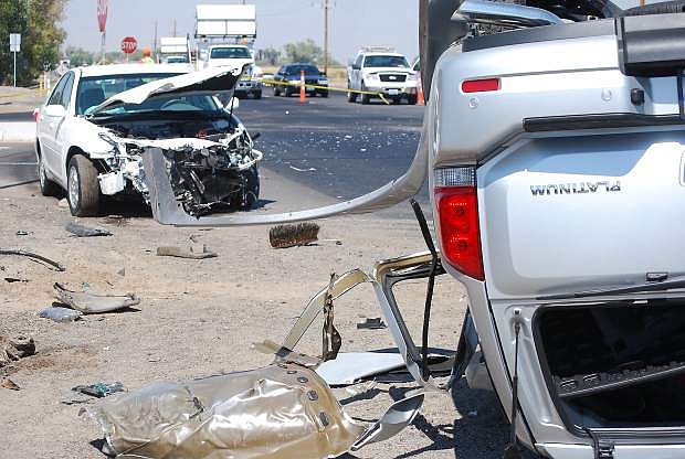 A two-vehicle accident Wednesday morning seriously injured a state worker in a construction zone on the Reno Highway  and also both drivers and  passengers from one of the cars.