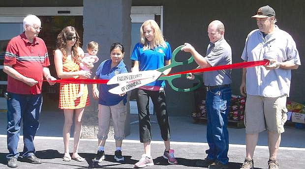 Louie&#039;s Dollar Plus recently conducted a grand re-opening and ribbon cutting for the relocation of their store. From left are John Tewell, Chamber of Commerce; Ashley Frey, Chamber of Commerce, with her daughter, Alice; Mila Slowan, employee; Madison Orozco, employee; Matt Louie, owner; and Royce Garrett, manager.