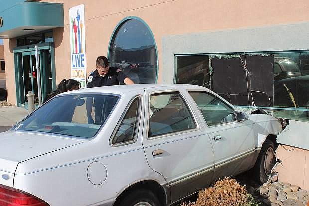 An elderly man drove into the front of the CC Communicatins builidng on West Wiliams Avenue Monday morning.