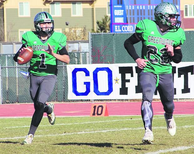 Fallon&#039;s Cade Vercellotti (22) looks for someone to block as quarterback Connor Richardson rolls out in Saturday&#039;s D1-A championship football game at Reno High School. Fallon defeated Moapa Valley, 34-27.