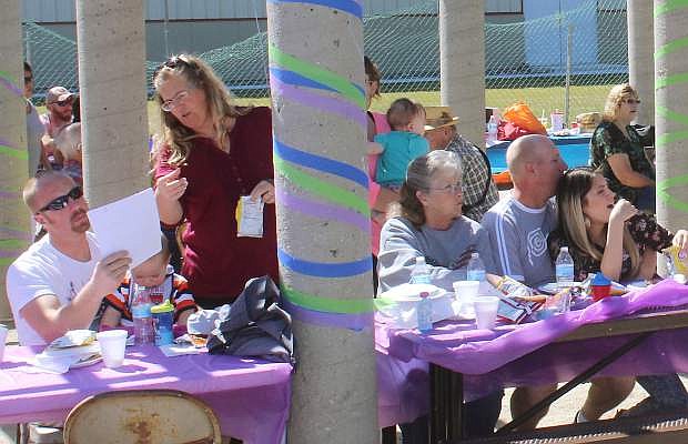 Several hundred people enjoy the music and food at the family day.