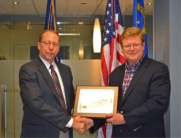 Nevada Farm Bureau Executive Vice President Clay McCauley presents Congressman Mark Amodei the Friend of Farm Bureau Award.
