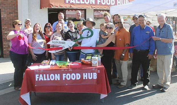 The Fallon Chamber of Commerce conducted a ribbon-cutting ceremony that launched this year&#039;s Food Hub Fridays Farmers Market. From left are Christy Lattin, Amber Ayers, Deborah Stewart, Frances Bourque, Tim Coverston, Natalie Parrish and Adeline, Barry Wood, Rick Lattin and John Tewell.