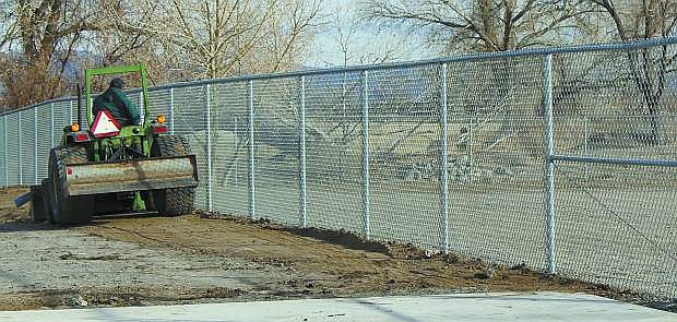 Work was being done on Wednesday  alongside a taller chainlink  fence at Numa Elemntary school.