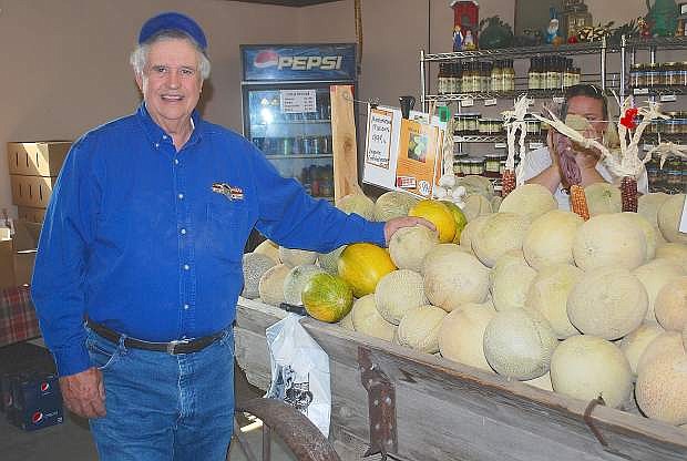 Cantaloupe grower Rick Lattin, who is also a member of the Fallon Cantaloupe Festival board, shows off the different types of melons that will be at this weekend&#039;s annual event.