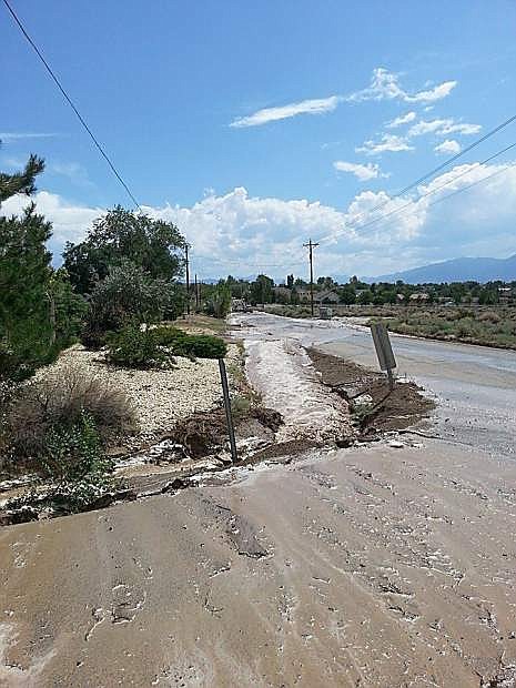 Water rushes over the road on Aug. 11.