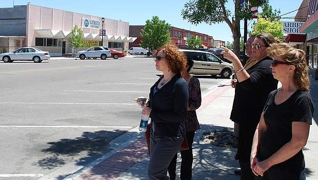 Rachel Dahl, second fromright, executive director of the Churchill Economic Development Authority, took a group on a tour of downtown Fallon in June. In the background is Kent&#039;s Market, a proposed site for a new food hub distribution center.
