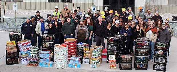 Employees from New Mlillenniunm recently donated food to the Out of Egypt Food Pantry.