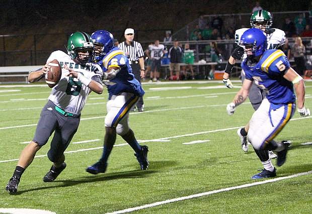 Fallon backup quarterback Joe Pyle attempts to avoid a South Tahoe defender during last week&#039;s game.