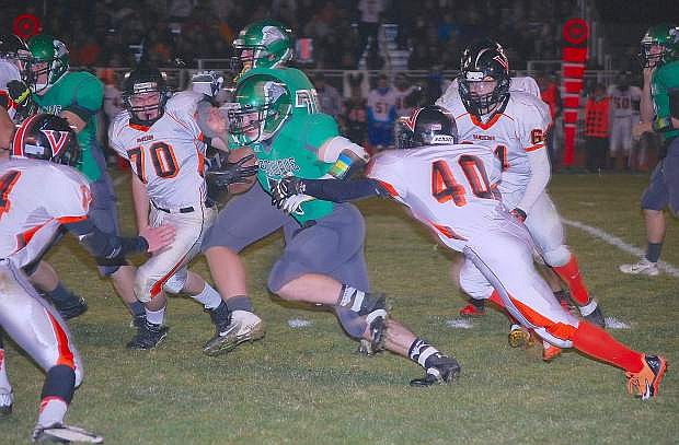 Fallon running back Trent Tarner busts through the Fernley line in last week&#039;s first-round playoff game. Fallon hosts Moaa Valley on Saturday at the Edward Arciniega Athletic Complex, and the winner of that game advances to state.