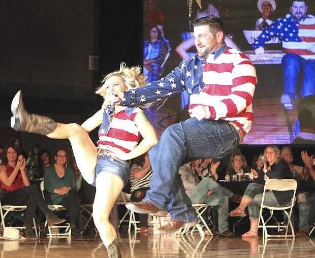 Instructor Alisa Merino and her partner Woody Worthington perform a two-step during the opening number of the Gotta Dance! competition benefiting the Suicide Prevention Network Friday night at the Douglas County Community Center.