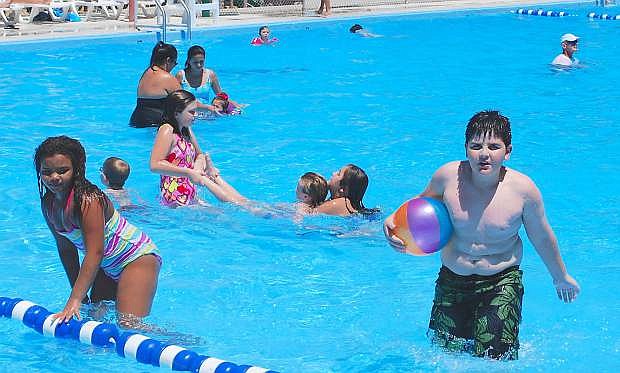 Youngsters cool off in the city&#039;s swimming pool on Monday as the mercury soared to 105 degrees.