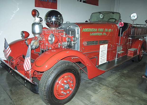 This rare 1937 Ahrens-Fox fire truck that has a distinctive polished chrome ball over its engine which serves as an air equalization chamber for the main water stream is displayed at the Marconi Automotive Museum in Orange County, Calif.