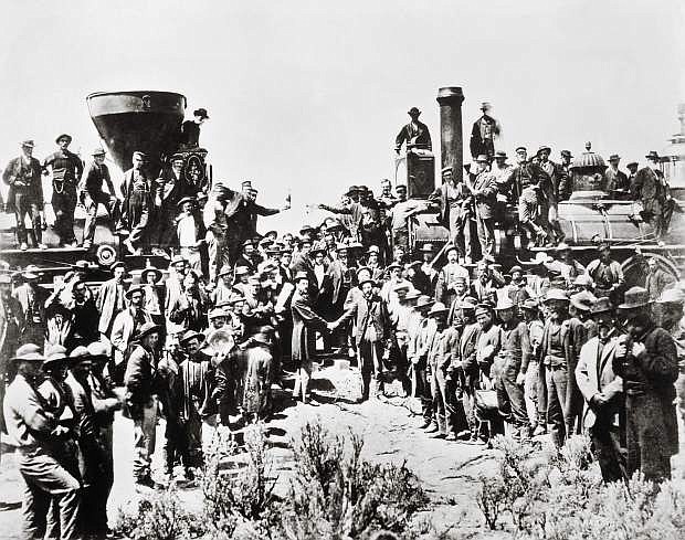 Railroad workers gather in Promontory, Utah, to celebrate the completion of the first Transcontinental Railroad on May 10, 1869. The completion spurred Western train robberies such as the one at Verdi because the trains transported large amounts of gold and silver bullion.