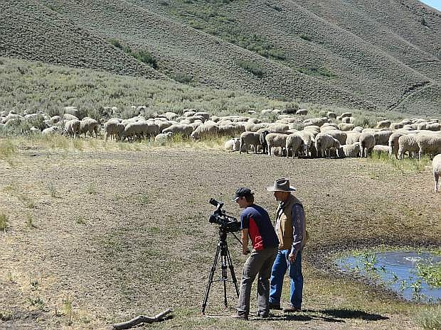 Producer, Dennis Golden as he directs a shot with KNPB videographer, Alex Muench, near a herd of sheep that narrowly escaped one of the many wild fires that scorched over 800,000 acres in Nevada in 2012..