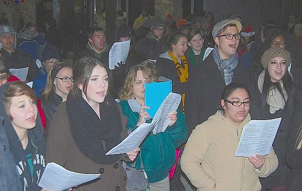 Students from the Churchill County High School music program sang Christmas songs and carols during Friday night&#039;s tree lighting. The high school will have three performances next week.