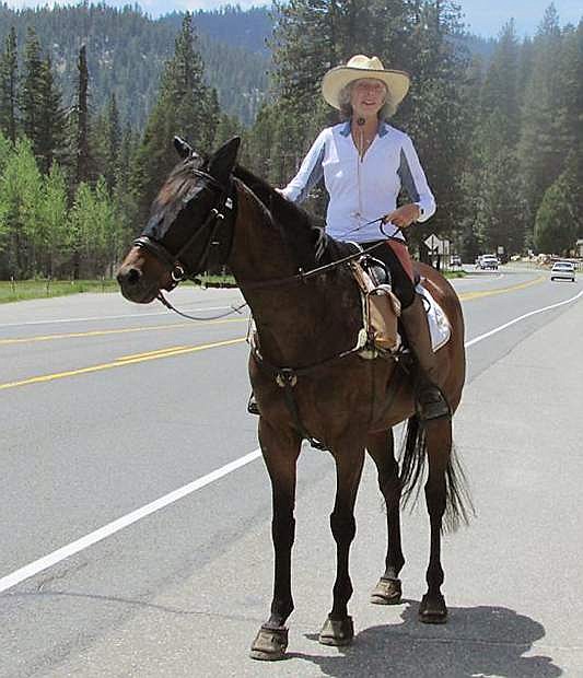 Valerie Ashker, who made a recent stop in Fallon, is riding her horse across the country to raise awareness about giving retired racehorses a second career.
