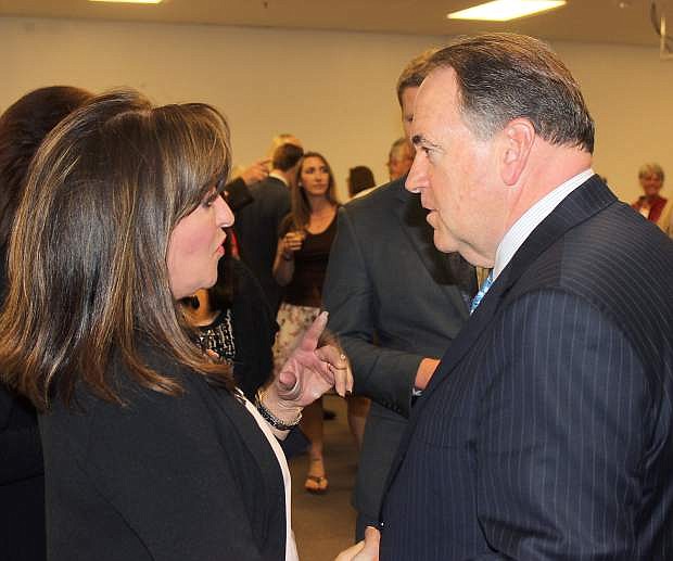 Former Arkansas Gov. Mike Huckabee and Cheri Wood have a conversation during his Carson City stop in late March. Huckabee will be in Fallon on Monday morning.