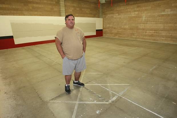 Pat McKinnish, owner of Guns N Ammo stands in a space that he would like to build a 25-yard indoor gun range.