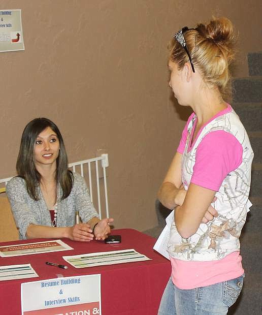 Jasmine Gonzales, left, worked with applicants on interview and resume writing skils.
