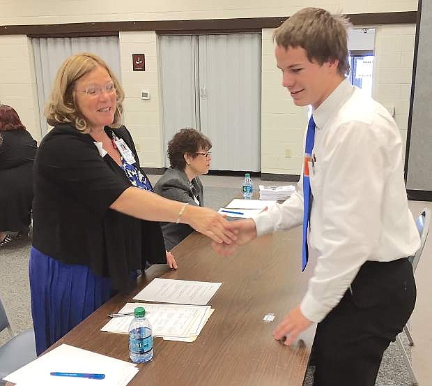 Raylene Stiehl of Banner Churchill Community Hospital shakes hands with student Geoff Campbell after he completes an interview.