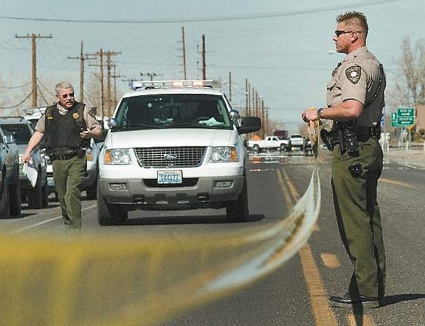 In this file photo from a 2007 murder, Churchill County Sheriff&#039;sdeputies Mark Joseph, left, and Tony Hollister, now with the Nevada Highway Patrol, secure an area around two houses south of Fallon on the Schurz Highway  after a fatal shooting at one of the residences. Joseph, who has retired fromteh CCSO, said he enjoyed investigations as a deputy.