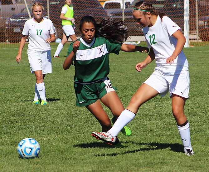 Mayla Dahl passes the ball in front of an Incline defender in Saturday&#039;s 3A match.