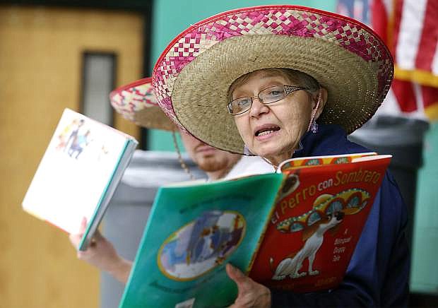 Elisa Seiler, with the Carson City Library, reads in Spanish to students in the Parks and Recreation after-school program at Mark Twain Elementary School in Carson City, Nev., on Tuesday, April 5, 2016. As part of a Diversity in Action grant from the Nevada State Library and Archives, librarians will read a story in English and Spanish at four elementary schools through April.