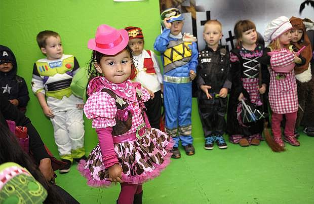 Zuleyka Hernandez, 2, and other children line up for the pre-K costume contest at the Carson City Library&#039;s Halloween party Wednesday.