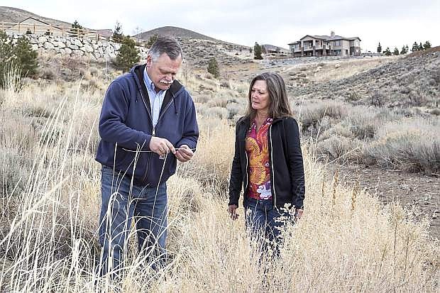 Ed Smith, natural resources specialist and director of the Living With Fire Program, advises homeowner Jenny Herz. Living With Fire received funding from the Bureau of Land Management to continue educating homeowners on how to live safely in wildfire-prone areas.