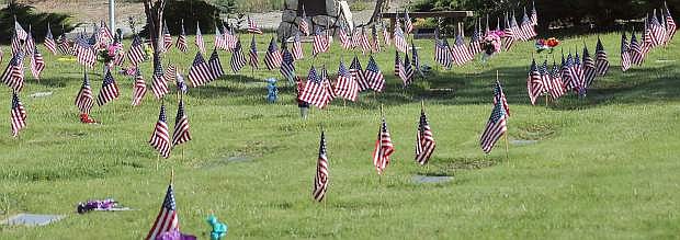 Lines of flags decorate the veterans&#039; section at the Churchill County Cemetery.