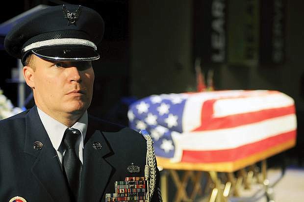 Master Sgt. Clinton Dudley, Nevada Air National Guard, stands watch in front of a casket holding Michael Landsberry, a fellow master sergeant in the Guard who was killed during a school shooting at Sparks Middle School. Landsberry was honored Sunday during a military ceremony at Sparks Christian Fellowship church.