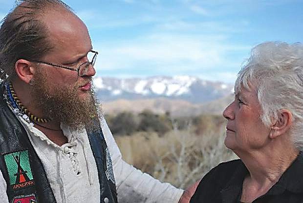 In this file photo from 2011, Marshall Compton, left, who has taken an active role in preserving the memory of the &quot;Shoe Tree,&quot; talks to Fredda Stevenson, owner of the Middlegate Bar and Restaurant.