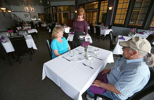 Linda McPeek serves lunch to Janet Goeringer and Joseph Perrin, of Ely, at Mystique Restaurant and Lounge in Carson City, Nev. Mystique serves an always-changing menu using fresh, local ingredients.