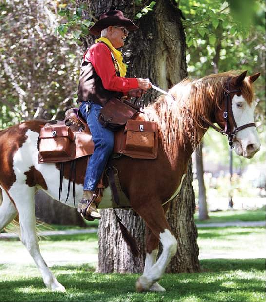 Bob Moore rides onto the grounds of the Nevada State Capitol on Thursday.