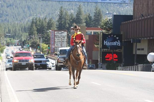 Bob Moore rides Casey on Highway 50 at Stateline during the annual Pony Express re-ride in 2013.