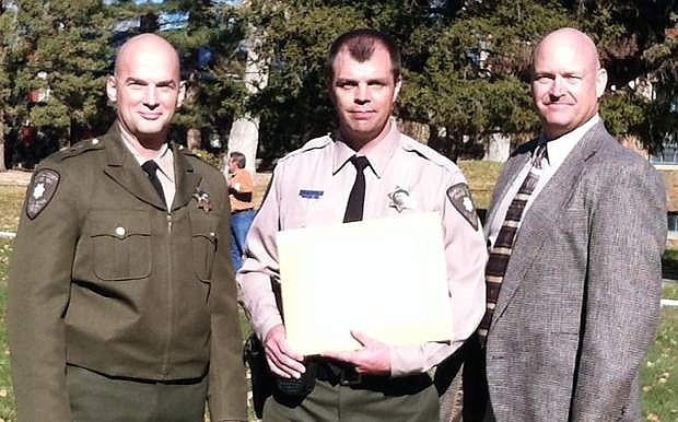 Churchill County Sheriff Deputy Nick Luesing, center, graduated from the Nevada POST Academy in Carson City on Nov. 19.  He has been with the CCSO for nearly four years.  From left are Sheriff Ben Trotter, Luesing and Capt. Mike Matheson.