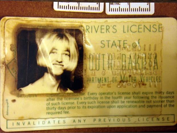 FILE - In this photo provided by the South Dakota Attorney Generals Office is  Cheryl Miller&#039;s driver&#039;s license that was found in a 1960 Studebaker pulled from a creek near Alcester, S.D. Miller and Pamella Jackson were last seen on May 19, 1971 driving to a gathering with classmates to celebrate the end of the school year. On April 15, 2014 authorities confirmed the 43-year-old mystery of the girls disappearance was solved and that the two 17-year-olds had died after driving into the creek. (AP Photo/South Dakota Attorney Generals Office, File)
