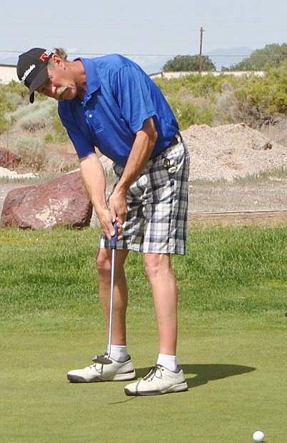 John Grainer puts the ball at the Rotary Club Golf Tournament.