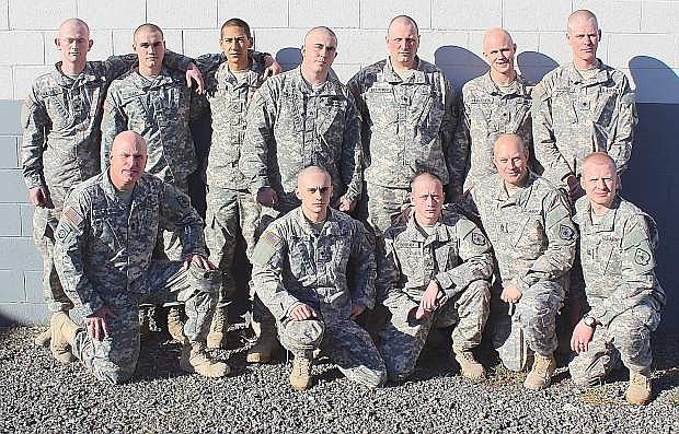 Members of the Nevada Army National Guard&#039;s 609th Engineer Company in Fallon shaved their heads to be in unity with 1st Lt. James Chandler, who is battling cancer. Back row from left are Cpl. Josh Killinger, Pvt. Jesse Berry, PFC Oscar Vega, Sgt. Adam Brayton, Spc. M. Krolikowski, Spc. Steven Herberlien and Spc. Randy Jackson. Front row from left are 1st Sgt. Jason Shipp, Spc. Mike Cristando, Cpl. Nick Cotham, Sgt. 1st Class Brian Dyer and Capt. Brett Eklund.