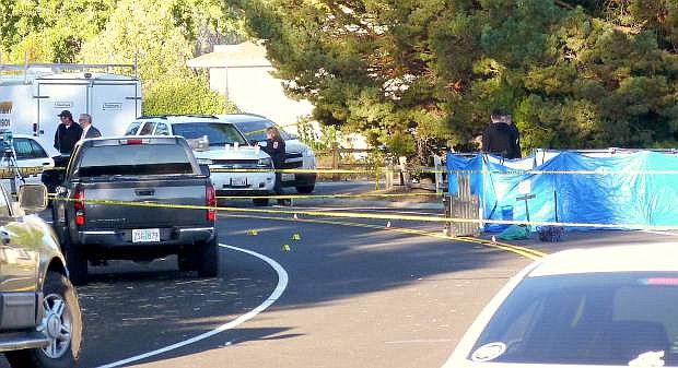 Investigators work a shooting scene on Manhattan Way this morning in the Gardnerville Ranchos.