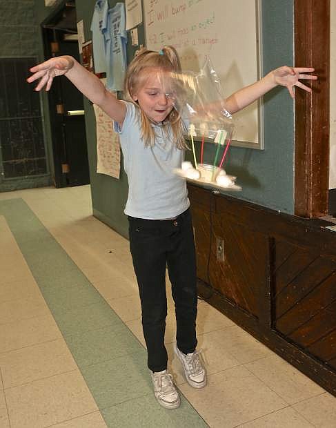 9-year-old Kailey Knox tests her lunar lander Thursday at STEM Night at Bordewich-Bray Elementary.