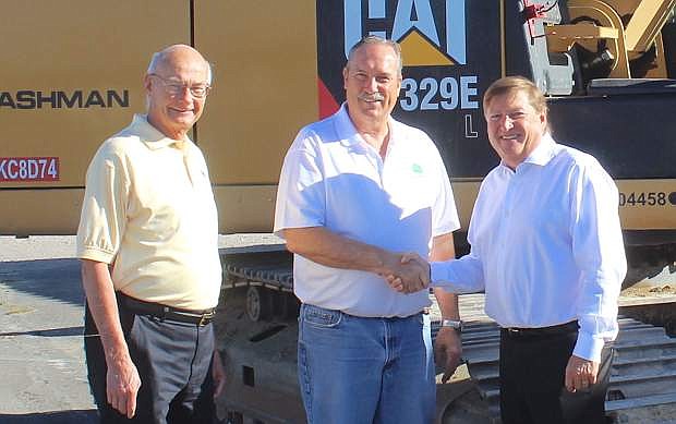 From left, Fallon Councilman Bob Erickson, Mayor Ken Tedford and Full House President and CEO Daniel R. Lee pose for a photo before the demolition of the office building begins.
