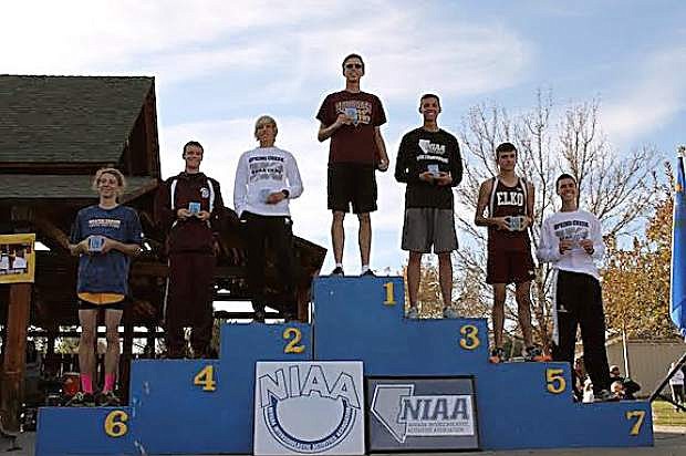 Churchill County High School&#039;s Tristen Thomson, third place, stands on the podium after being medaled in the state championships.