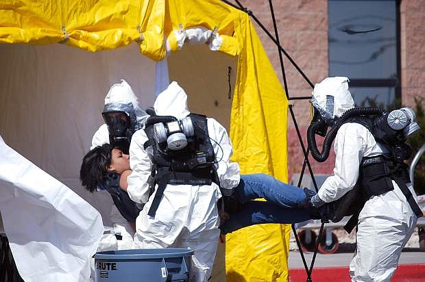 Medics from the Naval Air Station Fallon&#039;s Branch Health Clinic participate in a mock chemical spill drill on early 2012.